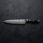 Genbu Gyuto Chef Knife – on the board